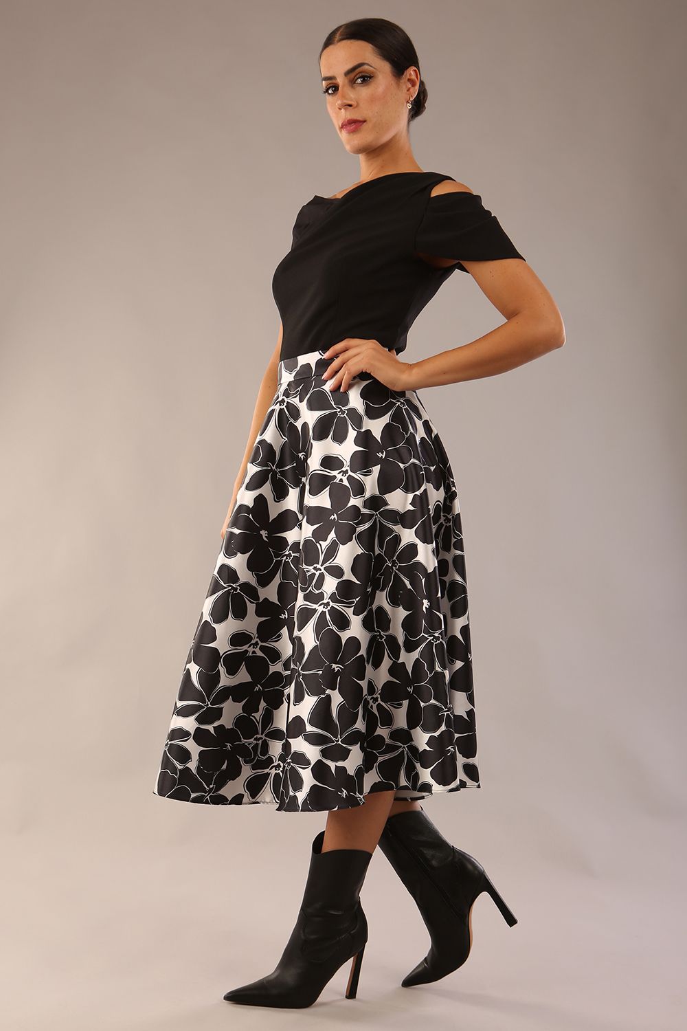 model is wearing a Gwendolyn Midi Length Skirt in Floral Print satin black and white a-line midi length skirt