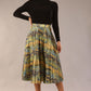 model wearing a diva catwalk Gwendolyn Midi Length Skirt in snakeskin print satin