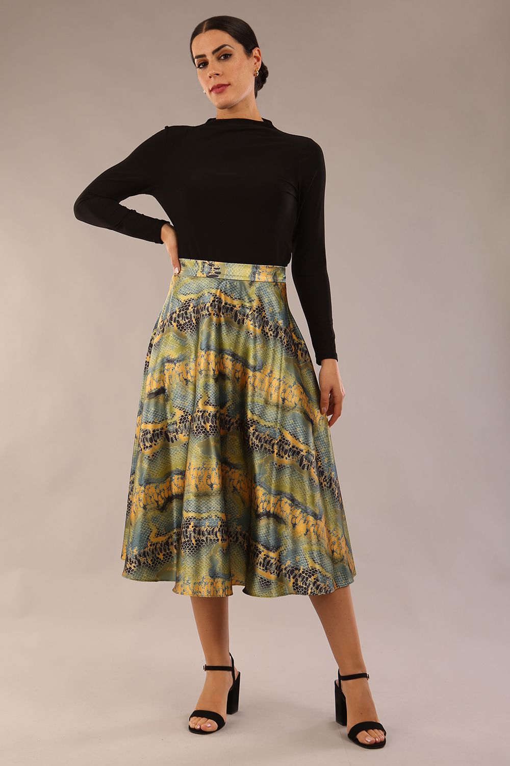 model wearing a diva catwalk Gwendolyn Midi Length Skirt in snakeskin print satin