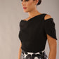 model wearing diva catwalk asymmetric neckline black short sleeve top