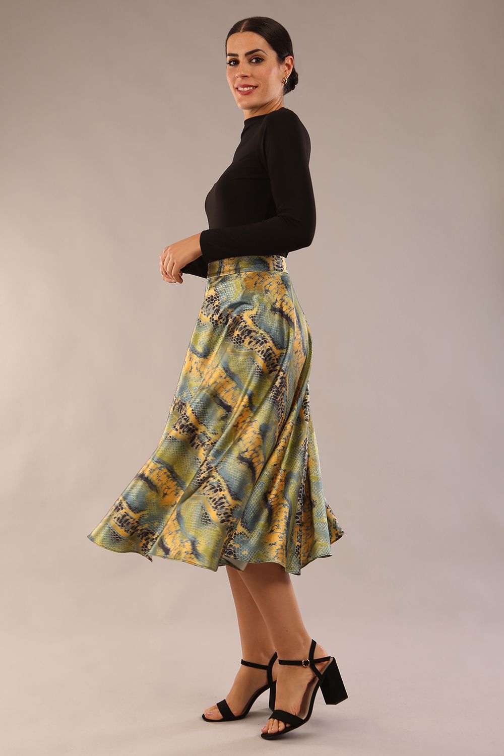 model wearing a diva catwalk Gwendolyn Midi Length Skirt in snakeskin print satin