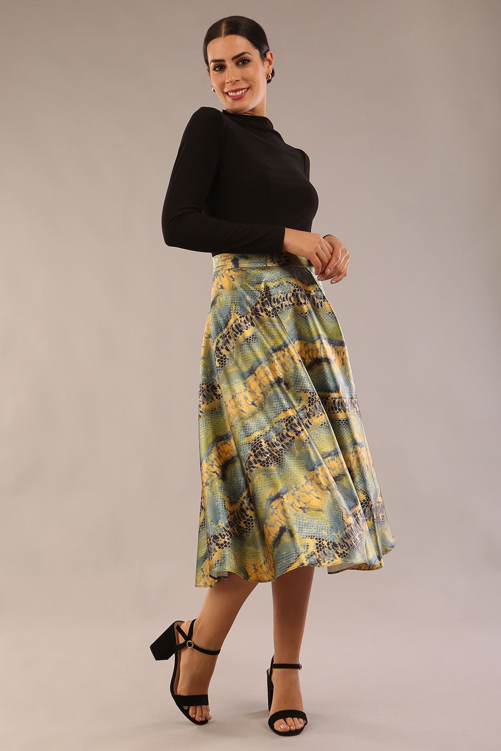 model wearing a diva catwalk Gwendolyn Midi Length Skirt in snakeskin print satin