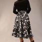 model is wearing a Gwendolyn Midi Length Skirt in Floral Print satin black and white a-line midi length skirt