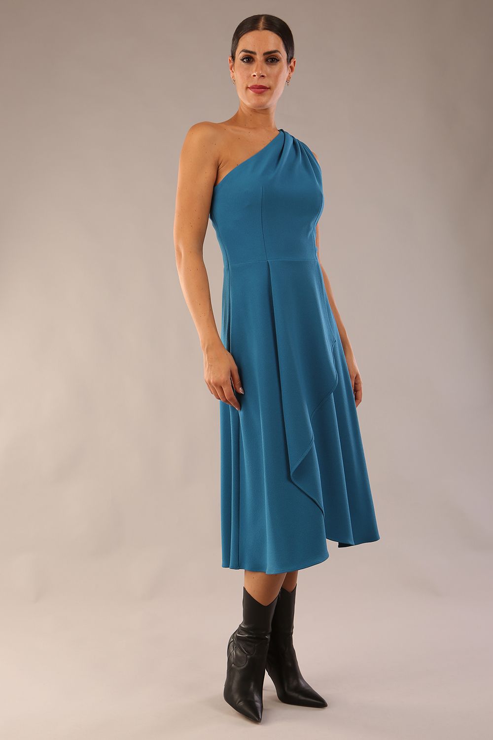 Model wearing a diva catwalk Portia One Shoulder A-line Dress midi length sleeveless style in Teal Colour