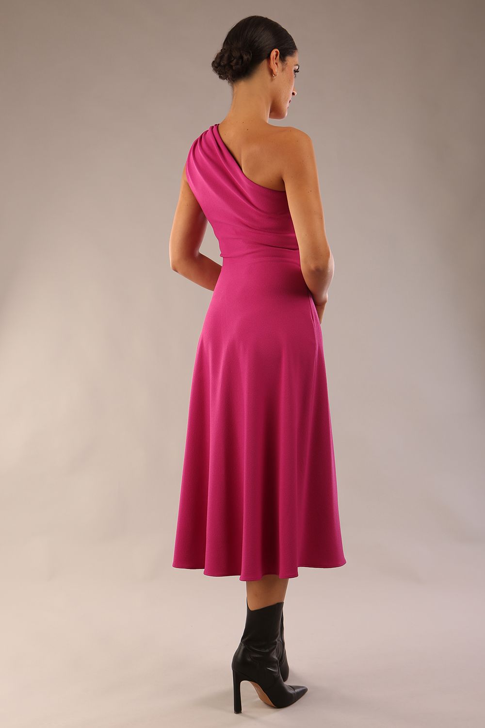 Model wearing a diva catwalk Portia One Shoulder A-line Dress midi length sleeveless style in Magenta Colour