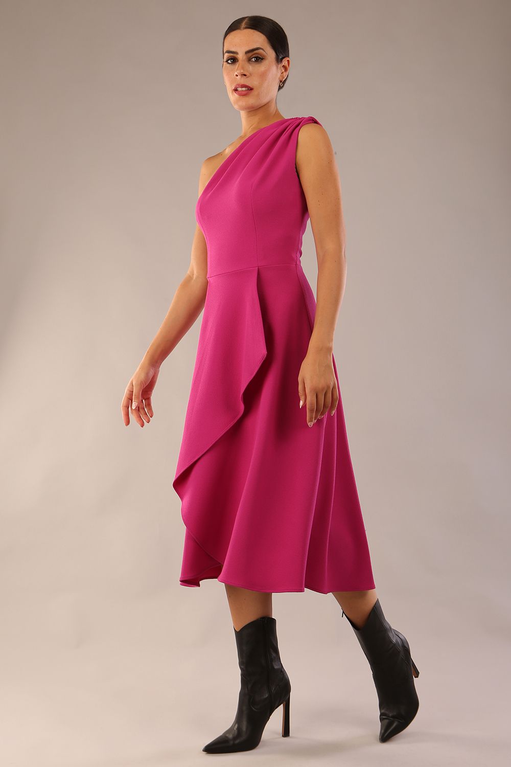 Model wearing a diva catwalk Portia One Shoulder A-line Dress midi length sleeveless style in Magenta Colour