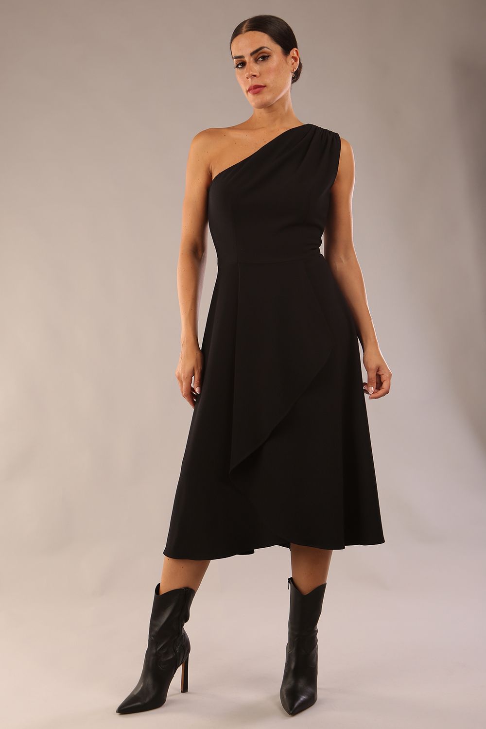 Model wearing a diva catwalk Portia One Shoulder A-line Dress midi length sleeveless style in Black Colour