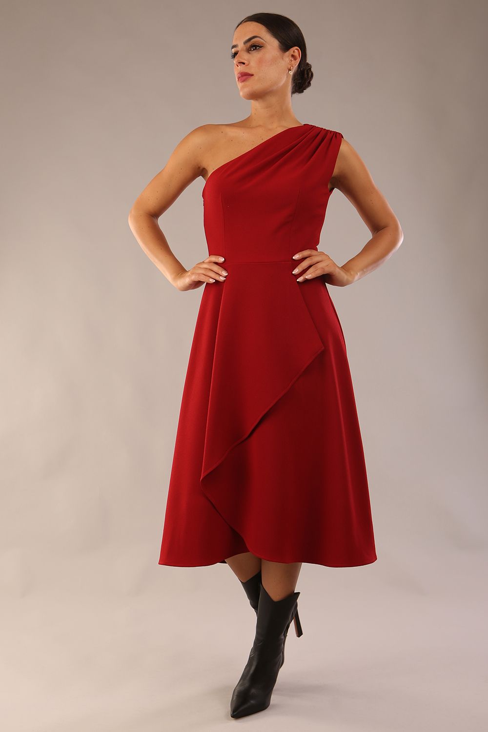 Model wearing a diva catwalk Portia One Shoulder A-line Dress midi length sleeveless style in Rosewood Red Colour