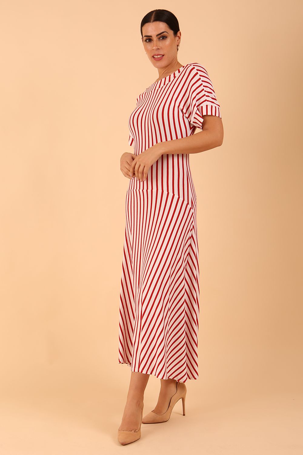 model wearing a divacatwalk Selene Stripes Swing Dress with stripes in red colour front side image