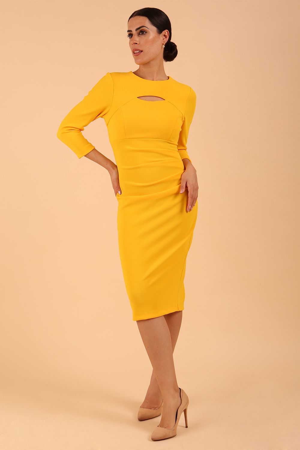 Model wearing a Clementine Keyhole Sleeved Pencil Dress in Sunshine Yellow colour