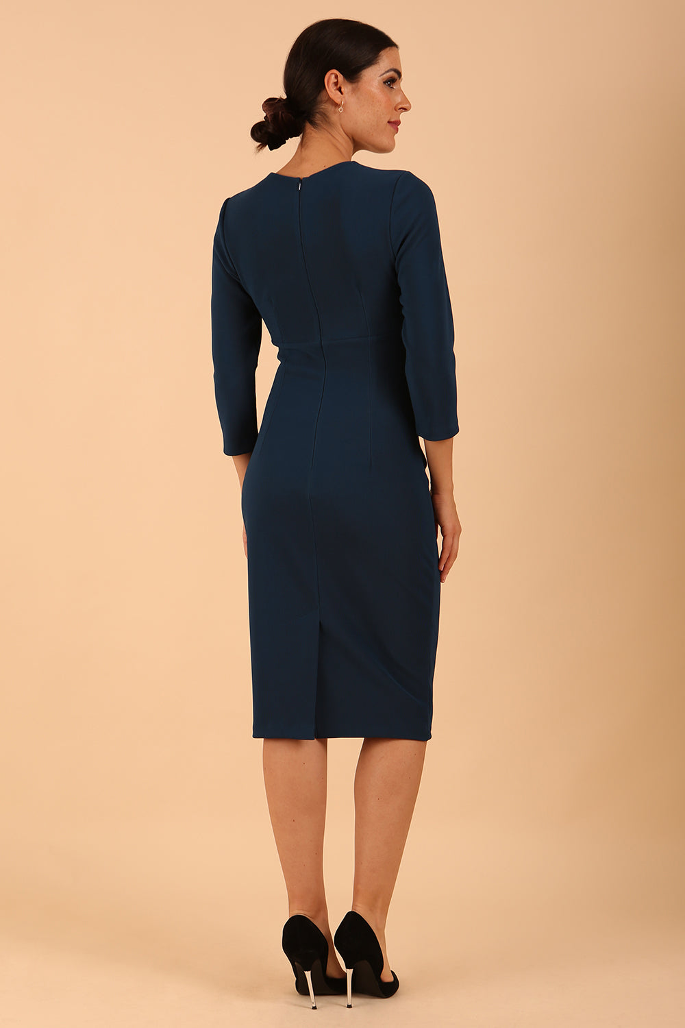 Model wearing a Clementine Keyhole Sleeved Pencil Dress in Teal colour