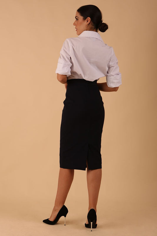 Model wearing a diva catwalk Tristana super stretch Pencil Skirt knee length in navy blue colour