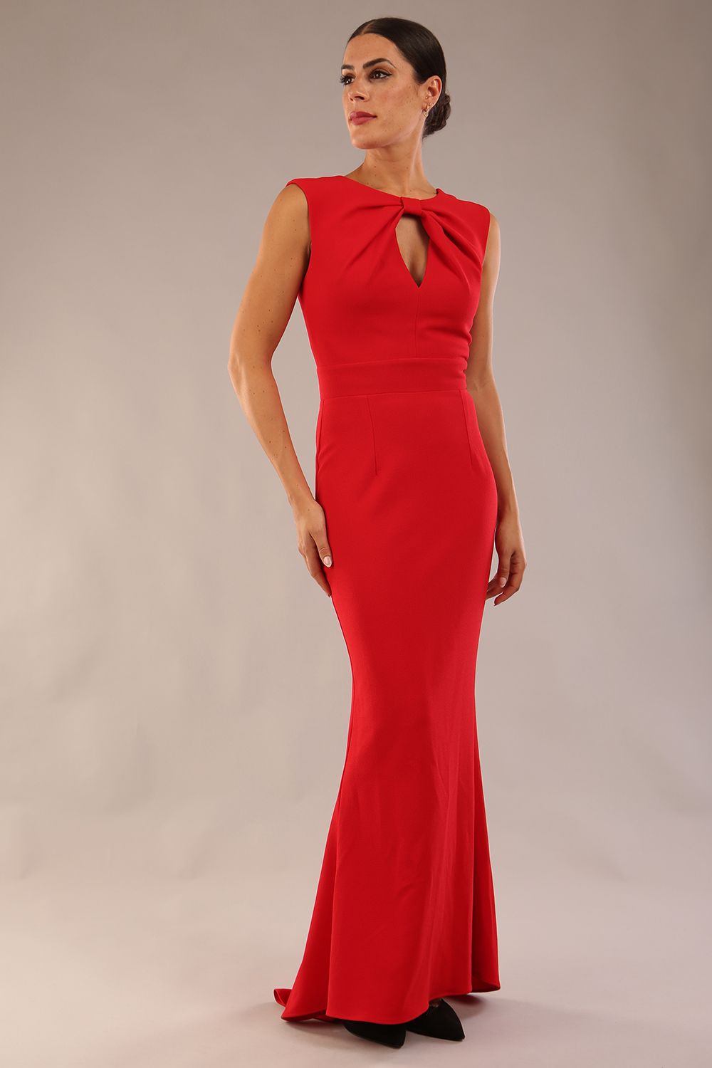 model wearing a diva catwalk Morwenna Keyhole Full Length Dress sleeveless style with keyhole detail at front in Scarlet Red colour