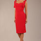 brunette model wearing a diva catwalk Philippa Pencil Wiggle Dress sleeveless style, tie detail on the shoulders knee length and sweetheart neckline in scarlet red colour front 