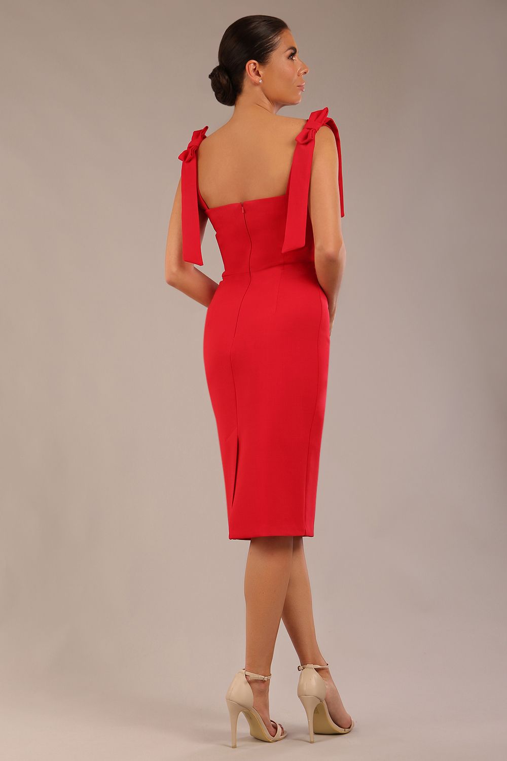 brunette model wearing a diva catwalk Philippa Pencil Wiggle Dress sleeveless style, tie detail on the shoulders knee length and sweetheart neckline in scarlet red colour back