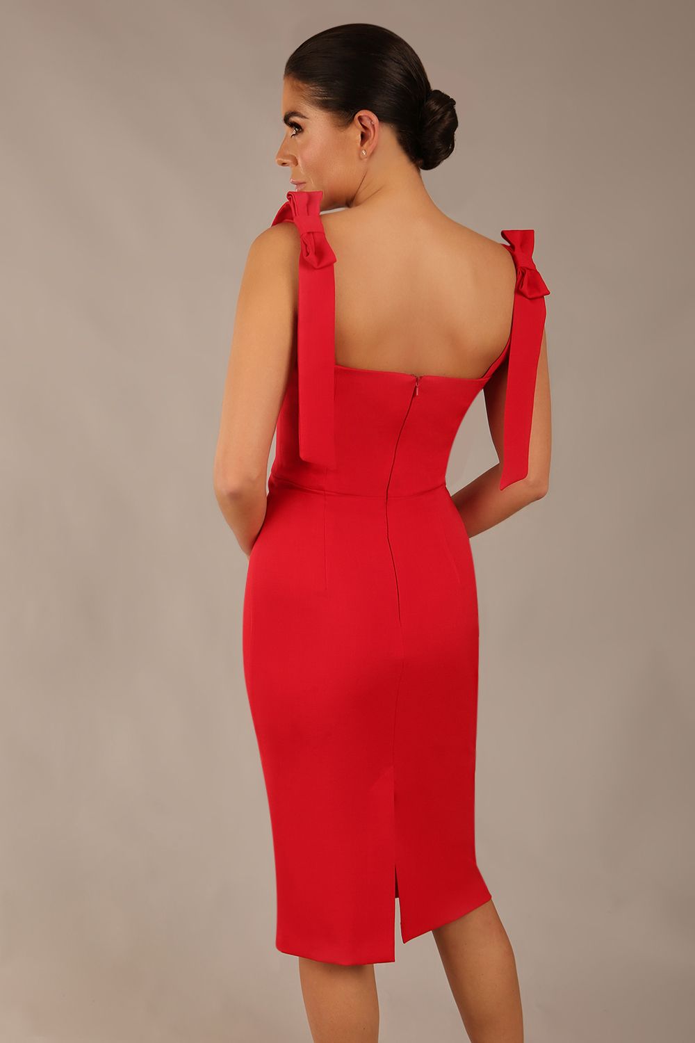 brunette model wearing a diva catwalk Philippa Pencil Wiggle Dress sleeveless style, tie detail on the shoulders knee length and sweetheart neckline in scarlet red colour back