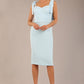 brunette model wearing a diva catwalk Philippa Pencil Wiggle Dress sleeveless style, tie detail on the shoulders knee length and sweetheart neckline in sky blue colour front