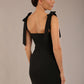 brunette model wearing a diva catwalk Philippa Pencil Wiggle Dress sleeveless style, tie detail on the shoulders knee length and sweetheart neckline in black colour back
