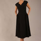 brunette model is wearing a diva catwalk Audrey a-line Dress sweetheart neckline and With Pockets and sleeveless with ankle length black colour front