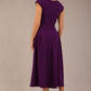 brunette model is wearing a diva catwalk Audrey a-line Dress sweetheart neckline and With Pockets and sleeveless with ankle length in passion purple colour back