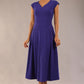 brunette model is wearing a diva catwalk Audrey Dress With Pockets sleeveless and ankle length in spectrum indigo colour