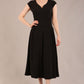 brunette model is wearing a diva catwalk Audrey Dress With Pockets sleeveless and ankle length in black colour