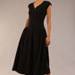 brunette model is wearing a diva catwalk Audrey Dress With Pockets sleeveless and ankle length in black colour