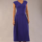 brunette model is wearing a diva catwalk Audrey Dress With Pockets sleeveless and ankle length in spectrum indigo colour