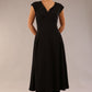 brunette model is wearing a diva catwalk Audrey Dress With Pockets sleeveless and ankle length in black colour