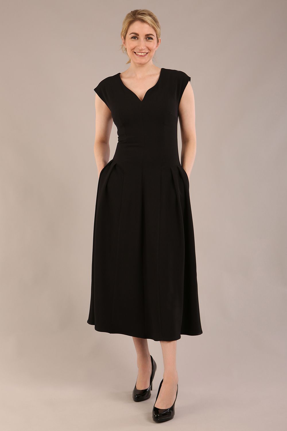 brunette model is wearing a diva catwalk Audrey Dress With Pockets sleeveless and ankle length in black colour