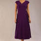 brunette model is wearing a diva catwalk Audrey Dress With Pockets sleeveless and ankle length in passion purple colour