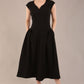 brunette model is wearing a diva catwalk Audrey Dress With Pockets sleeveless and ankle length in black colour