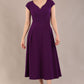 brunette model is wearing a diva catwalk Audrey Dress With Pockets sleeveless and ankle length in passion purple colour