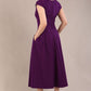 brunette model is wearing a diva catwalk Audrey Dress With Pockets sleeveless and ankle length in passion purple colour