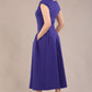 brunette model is wearing a diva catwalk Audrey Dress With Pockets sleeveless and ankle length in spectrum indigo colour