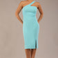 Model wearing a divacatwalk Sofia Pencil Dress knee length front side vent with diagonal halter neck in turquoise colour front