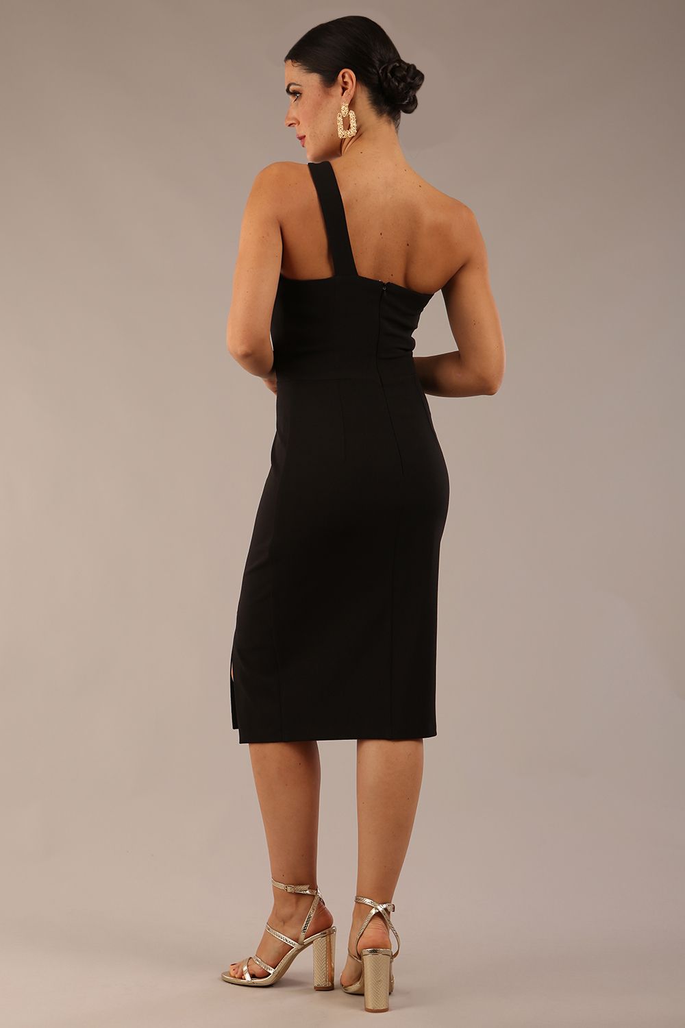 Model wearing a divacatwalk Sofia Pencil Dress knee length front side vent with diagonal halter neck in black colour back