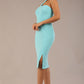 Model wearing a divacatwalk Sofia Pencil Dress knee length front side vent with diagonal halter neck in turquoise colour front