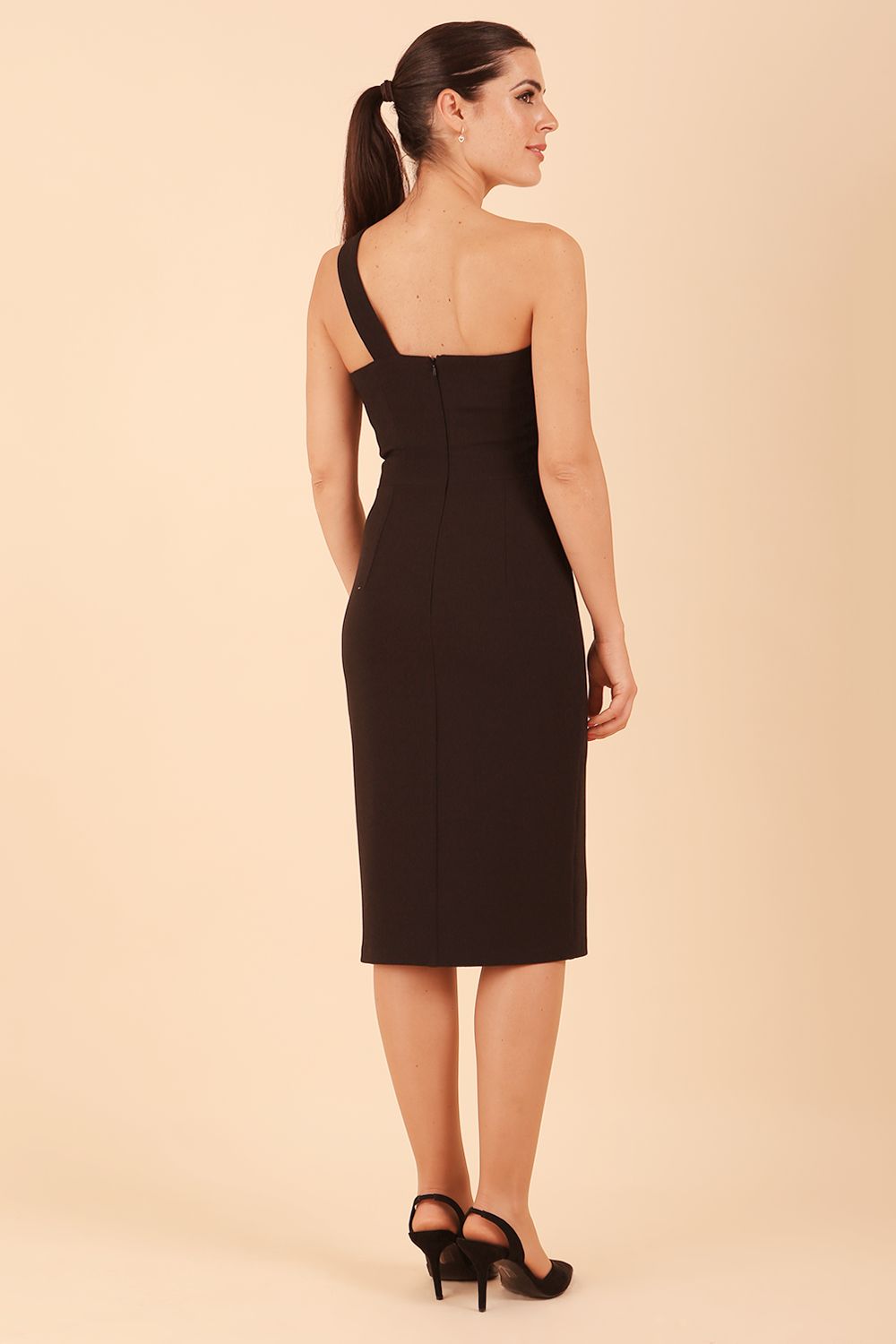 Model wearing a divacatwalk Sofia Pencil Dress knee length front side vent with diagonal halter neck in black colour back