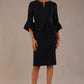 brunette model is wearing a diva catwalk Hobson ruffled sleeves Pencil Dress with tie waistband knee length in Dark Navy colour front
