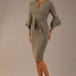brunette model is wearing a diva catwalk Hobson ruffled sleeves Pencil Dress with tie waistband knee length in Castlerock Grey colour front