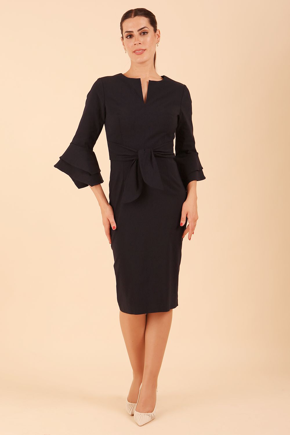 model wearing a diva catwalk Hobson ruffled sleeves Pencil Dress in Navy Blue colour