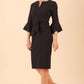 model wearing a diva catwalk Hobson ruffled sleeves Pencil Dress in Navy Blue colour