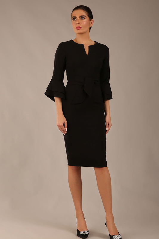 brunette model is wearing a diva catwalk Hobson ruffled sleeves Pencil Dress with tie waistband knee length in Black colour front