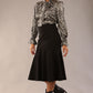 model is wearing a diva catwalk Fairford super stretch Fishtail Skirt midi length in black colour