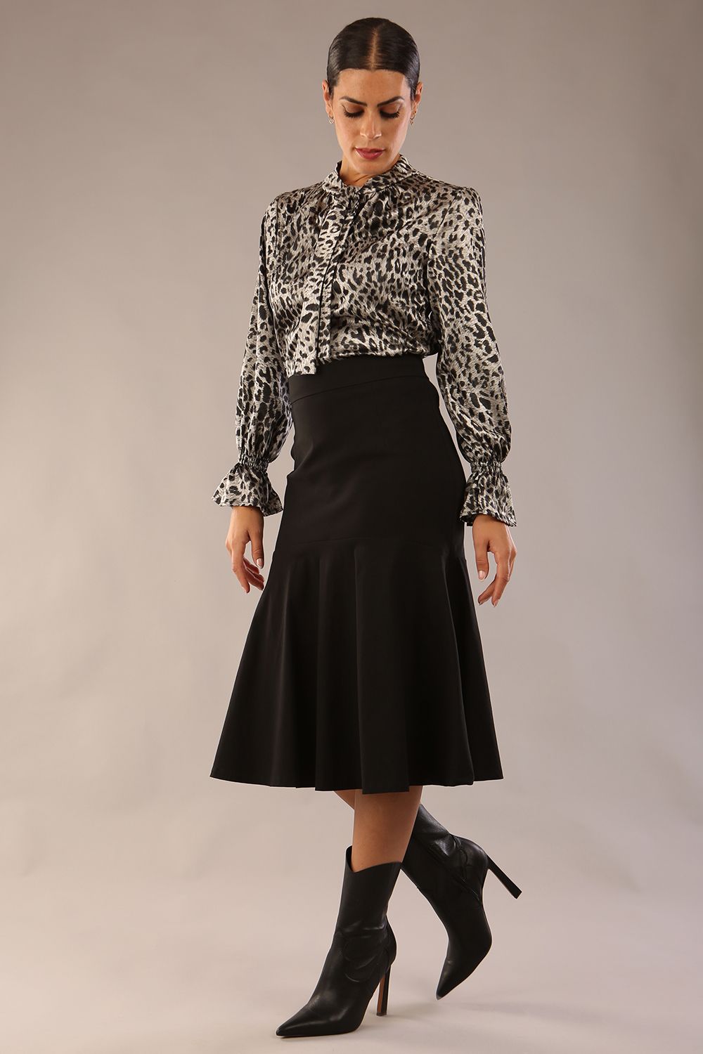 model is wearing a diva catwalk Fairford super stretch Fishtail Skirt midi length in black colour