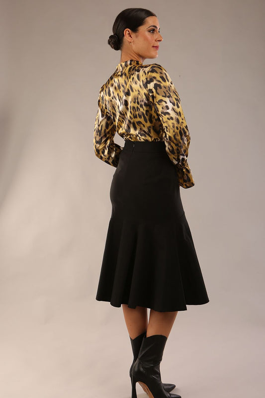 model is wearing a diva catwalk Fairford super stretch Fishtail Skirt midi length in black colour