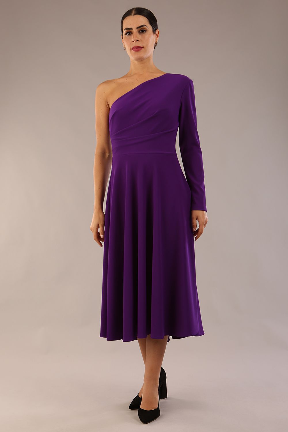 model wearing a diva catwalk Beverley One Shoulder A-line Dress in ribbed super stretch fabric and one long sleeve a-line skirt midi length in passion purple colour front