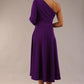 model wearing a diva catwalk Beverley One Shoulder A-line Dress in ribbed super stretch fabric and one long sleeve a-line skirt midi length in passion purple colour back