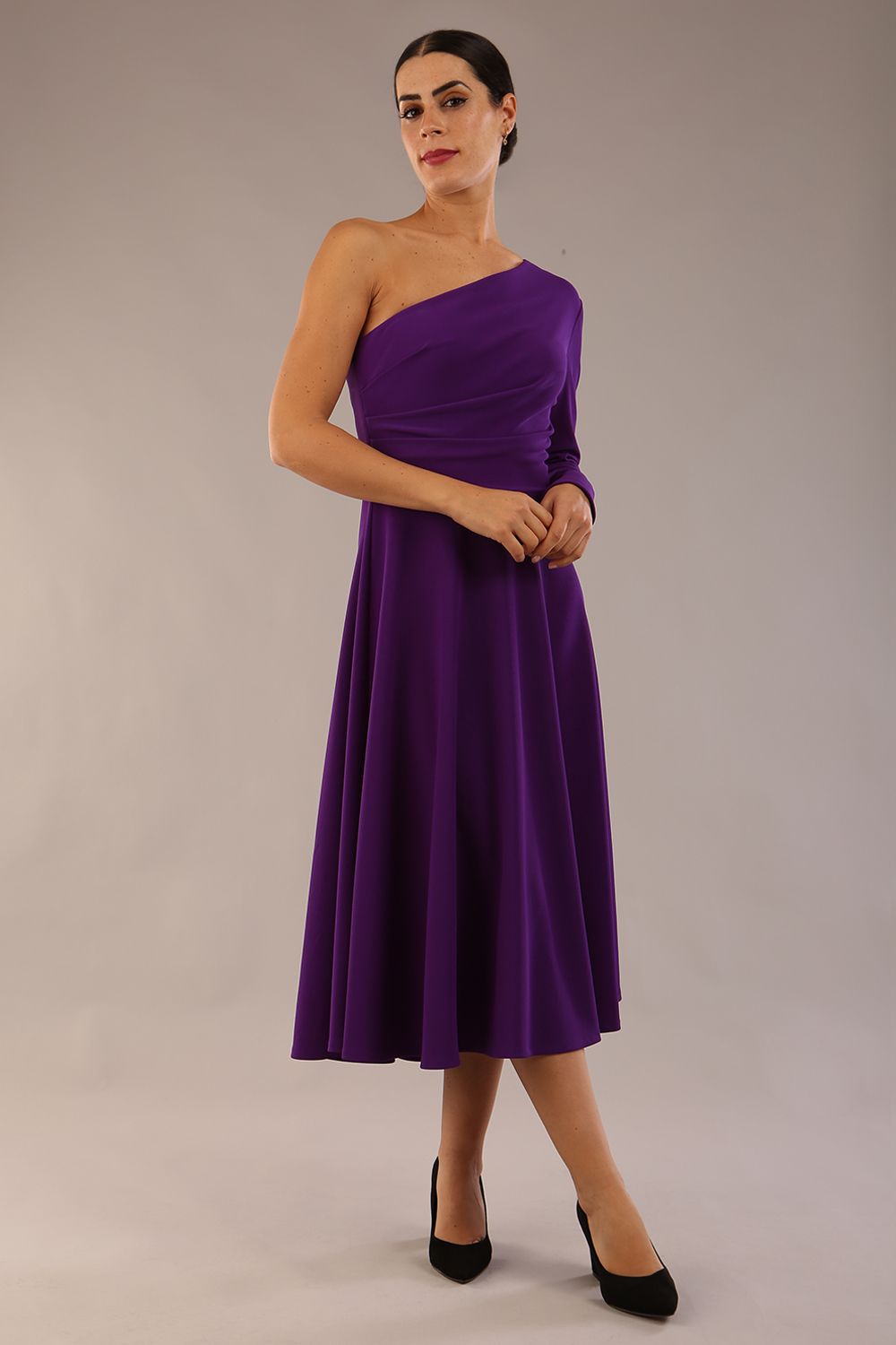 model wearing a diva catwalk Beverley One Shoulder A-line Dress in ribbed super stretch fabric and one long sleeve a-line skirt midi length in passion purple colour front